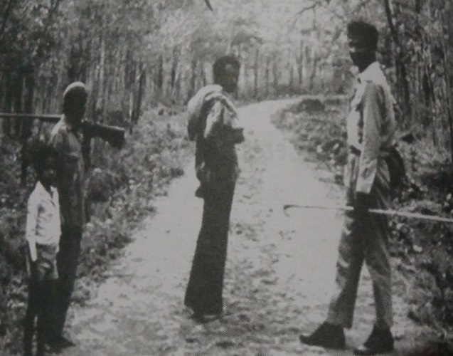 Chinnappa in the forest with the Jenu Kurubas, the local tribesmen reputed for their skill in collecting honey and forest produce