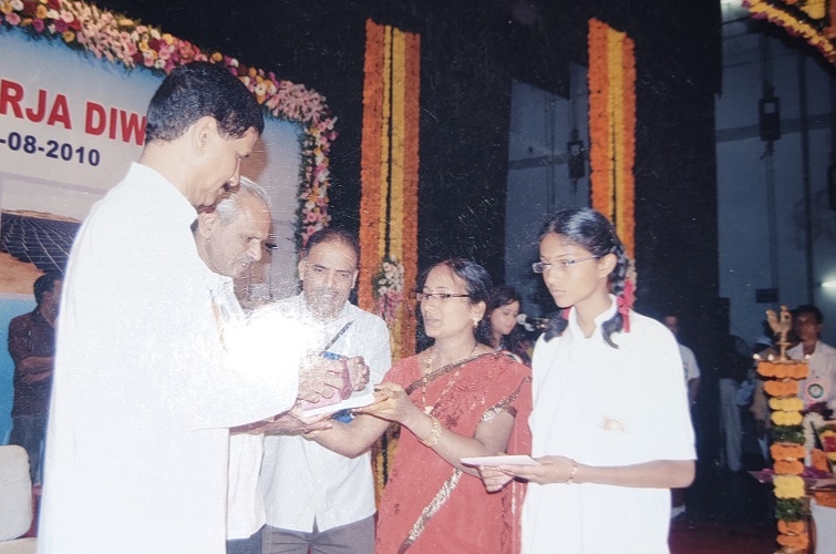 Receving prizes for Rajiv Gandhi Akshaya Urja Divas Event-State level Drawing Competition