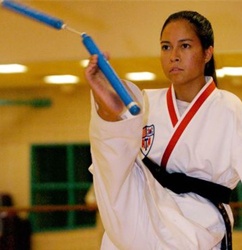 Training in Taekwondo at the age of 10 in her hometown of Sierra Vista and achieved black belt at the age of 14