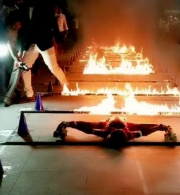five-year-old girl set on to skate under a horizontal bar placed at as low as 8 inches and that which was blazing in the fire