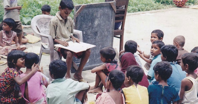 10YO has his own school. He teaches what he learns in school to the students. Sounds absurd